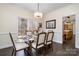 Bright dining room with modern table and a view of the backyard at 125 High Sail Ct, Mooresville, NC 28117