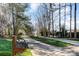 Long driveway leading up to property with mature landscaping and mailbox visible at 125 High Sail Ct, Mooresville, NC 28117