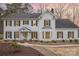 Charming two-story home features a well-maintained front yard with beautiful landscaping and classic architectural details at 125 High Sail Ct, Mooresville, NC 28117
