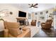 Comfortable living room with a fireplace, large window and recessed lighting at 125 High Sail Ct, Mooresville, NC 28117