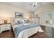 A cozy bedroom with a ceiling fan, hardwood floors, and a bed with two bedside tables at 125 High Sail Ct, Mooresville, NC 28117