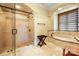 Modern bathroom with a glass shower, soaking tub, and stone tile floors and walls at 1312 Lookout Cir, Waxhaw, NC 28173