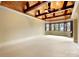 This expansive bonus room has a unique wood plank ceiling, exposed beams, and several windows at 1312 Lookout Cir, Waxhaw, NC 28173