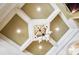 Close up of the decorative ceiling design with a modern chandelier at 1312 Lookout Cir, Waxhaw, NC 28173