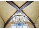Chandelier featuring wooden beams and designer lighting at 1312 Lookout Cir, Waxhaw, NC 28173