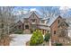 Stately brick and stone home with manicured landscaping and a welcoming front entrance at 1312 Lookout Cir, Waxhaw, NC 28173