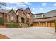 Charming home with stone and brick exterior, well-maintained landscaping, and inviting curb appeal at 1312 Lookout Cir, Waxhaw, NC 28173
