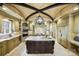 Gourmet kitchen with an island, custom cabinetry, high-end appliances, and designer ceiling at 1312 Lookout Cir, Waxhaw, NC 28173