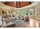 Bright living room with hardwood floors, a wood ceiling, and large windows at 1312 Lookout Cir, Waxhaw, NC 28173
