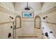 Spacious walk-in shower with rain shower head, body jets and bench seating, creating a luxurious experience at 1312 Lookout Cir, Waxhaw, NC 28173