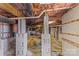 Unfinished basement with concrete block walls and exposed ductwork at 137 Hunters Hill Dr, Statesville, NC 28677
