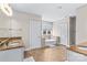 Luxurious bathroom featuring double vanities, soaking tub, and tiled floors at 137 Hunters Hill Dr, Statesville, NC 28677