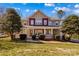 Beautiful two-story home showcasing a large front porch and well-maintained lawn and landscaping at 137 Hunters Hill Dr, Statesville, NC 28677