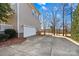 Spacious driveway leading to a two-car garage, complemented by well-maintained landscaping at 137 Hunters Hill Dr, Statesville, NC 28677