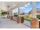Covered front porch supported by brick columns offers a scenic view of the surrounding landscape at 137 Hunters Hill Dr, Statesville, NC 28677