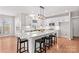 Bright kitchen with a large island, white cabinetry, modern appliances, and stylish pendant lighting at 137 Hunters Hill Dr, Statesville, NC 28677