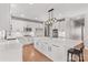 Bright kitchen with a large island, white cabinetry, modern appliances, and stylish pendant lighting at 137 Hunters Hill Dr, Statesville, NC 28677