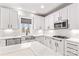 Modern kitchen with stainless steel appliances, quartz countertops, and custom white cabinetry at 137 Hunters Hill Dr, Statesville, NC 28677