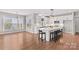 Spacious kitchen with a large island, white cabinetry, modern appliances, and eat in area at 137 Hunters Hill Dr, Statesville, NC 28677
