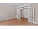 Spacious living room with double doors leading to the foyer area and hardwood floors at 137 Hunters Hill Dr, Statesville, NC 28677