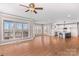 Open layout with hardwood floors, a modern kitchen, and sunlit windows at 137 Hunters Hill Dr, Statesville, NC 28677