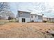 The backyard has a home with a nice sized yard, ideal for recreation and outdoor activities at 1404 Nottingham Rd, Kannapolis, NC 28081