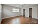 Bedroom with hardwood flooring, ceiling fan and sliding door closets at 1404 Nottingham Rd, Kannapolis, NC 28081