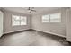 Bedroom with ample natural light, neutral paint, and updated ceiling fan at 1404 Nottingham Rd, Kannapolis, NC 28081