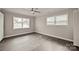 Bright bedroom with updated trim, paint, ceiling fan and hardwood flooring at 1404 Nottingham Rd, Kannapolis, NC 28081