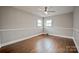Bedroom with neutral paint, trim and hardwood flooring at 1404 Nottingham Rd, Kannapolis, NC 28081