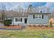 Charming single story home featuring gray siding, black shutters, and a well-maintained front yard at 1404 Nottingham Rd, Kannapolis, NC 28081