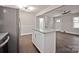 Open-concept kitchen featuring granite countertops and stainless steel appliances at 1404 Nottingham Rd, Kannapolis, NC 28081