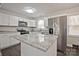 Bright kitchen featuring stainless steel appliances, white cabinets, and granite countertops at 1404 Nottingham Rd, Kannapolis, NC 28081