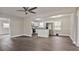Open-concept living area featuring gray walls and new dark wood flooring at 1404 Nottingham Rd, Kannapolis, NC 28081