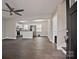 Open-concept living room with modern lighting, neutral walls, and new floors at 1404 Nottingham Rd, Kannapolis, NC 28081
