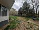This backyard offers a serene outdoor space, perfect for Gathering gatherings and gardening at 1536 Plyler Lake Rd, Gastonia, NC 28054