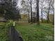 Enjoy outdoor tranquility with this serene backyard space surrounded by nature's beauty and privacy at 1536 Plyler Lake Rd, Gastonia, NC 28054