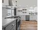 Bright kitchen with stainless appliances, modern fixtures, and view to back yard at 1536 Plyler Lake Rd, Gastonia, NC 28054