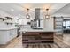 Bright kitchen features stylish island, modern appliances, and floating shelves at 1536 Plyler Lake Rd, Gastonia, NC 28054