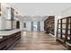 Bright open living space featuring wood accent wall with fireplace and modern light fixtures at 1536 Plyler Lake Rd, Gastonia, NC 28054
