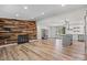 Open floor plan featuring a wood accent wall with a fireplace at 1536 Plyler Lake Rd, Gastonia, NC 28054