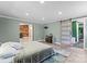 The main bedroom is bright and features an en suite bathroom and walk-in closet with sliding doors at 1536 Plyler Lake Rd, Gastonia, NC 28054