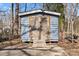 This photo showcases a functional outdoor storage shed with double doors, ideal for garden tools and equipment at 1536 Plyler Lake Rd, Gastonia, NC 28054