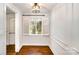 Cozy dining area with hardwood floors, window shutters, and stylish lighting at 1831 Jameston Dr, Charlotte, NC 28209