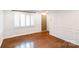 Bright living room with beautiful hardwood floors and decorative wall trim at 1831 Jameston Dr, Charlotte, NC 28209