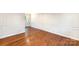 Bright and airy living room with gleaming hardwood floors and decorative wall trim at 1831 Jameston Dr, Charlotte, NC 28209