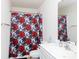 Bathroom featuring a vanity with white cabinets and floral-patterned shower curtain at 1953 Boulder Ct, Gastonia, NC 28054