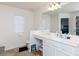Bright bathroom with a single sink vanity, large mirror, and an alcove toilet at 1953 Boulder Ct, Gastonia, NC 28054