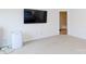 Spacious bedroom with neutral carpet, a TV mounted on the wall, and an ensuite bathroom at 1953 Boulder Ct, Gastonia, NC 28054