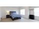 A bright bedroom with a queen-sized bed and a modern side table with dark wood furnishings at 1953 Boulder Ct, Gastonia, NC 28054
